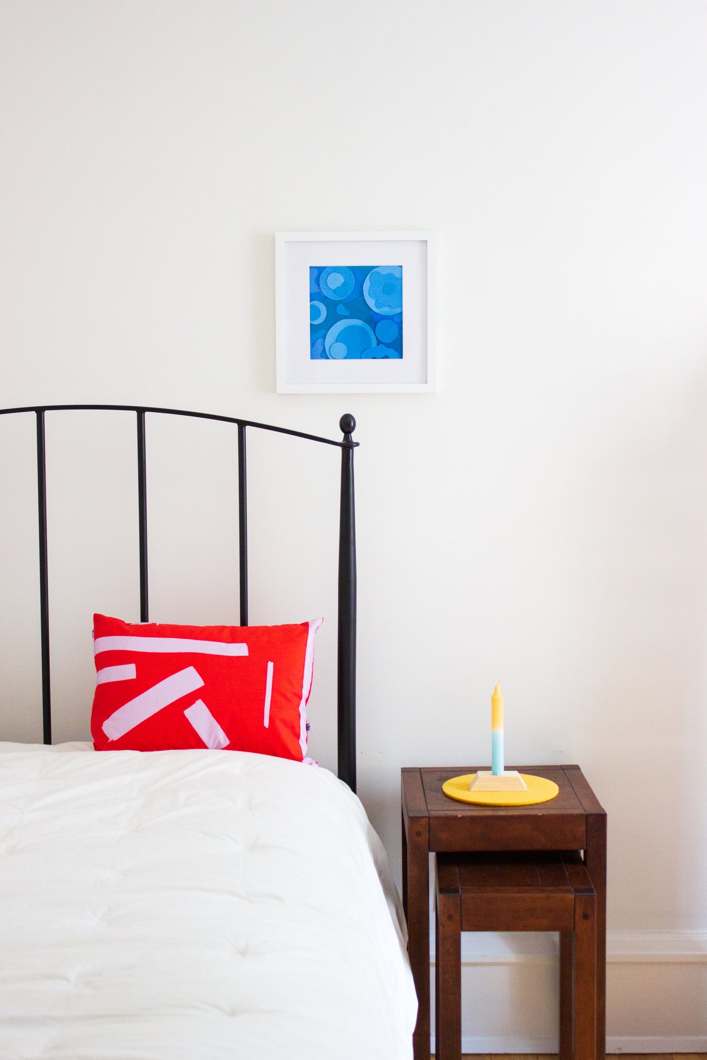 Red and Lilac Pillow on Bed