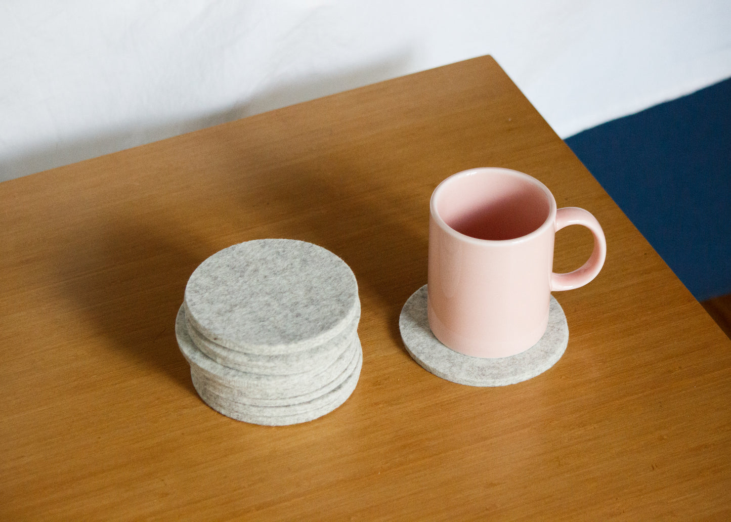 Weiß Felt Coaster and Mug on Table