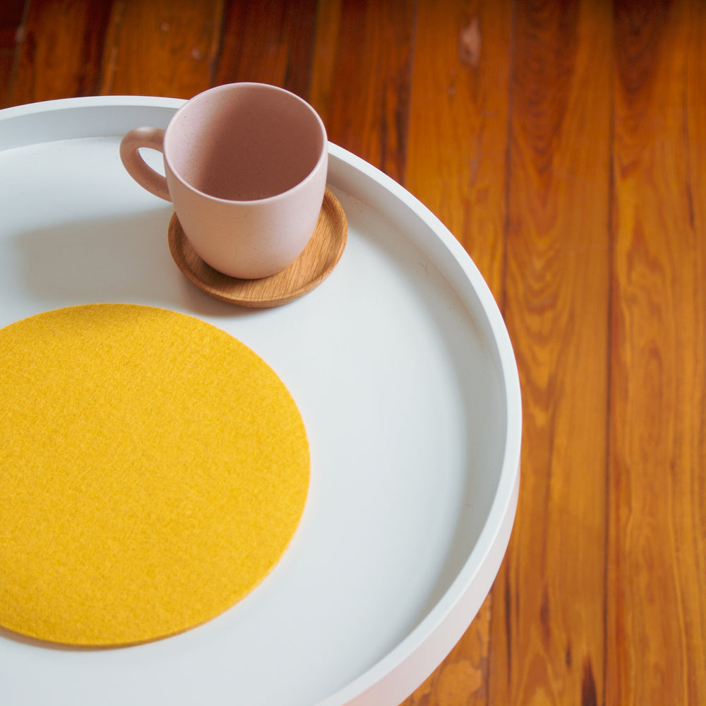Rose Pink Mug with Wooden Saucer on Table
