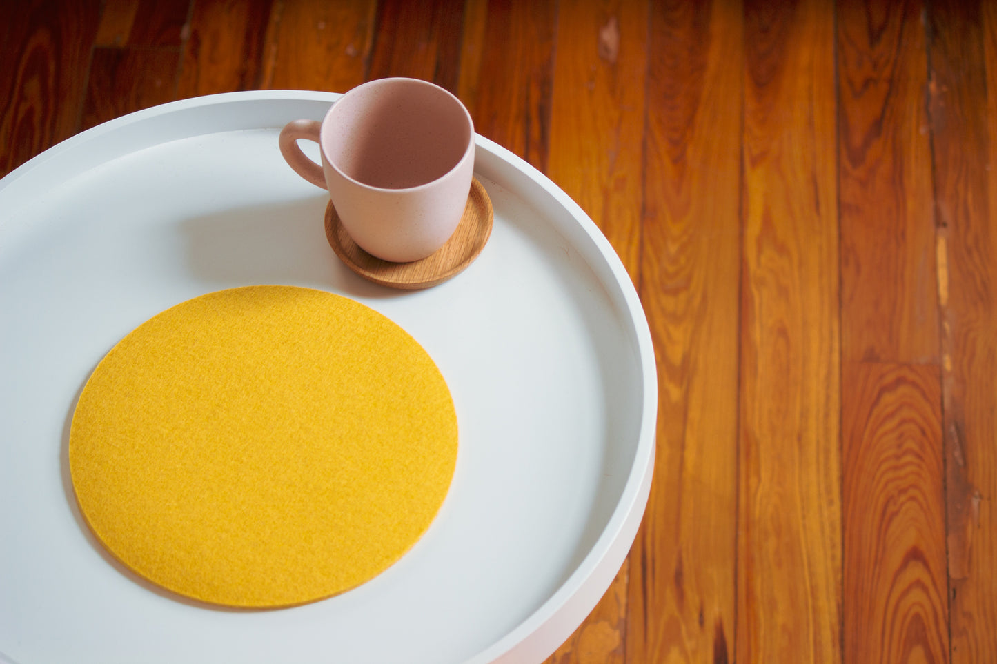 Rose Pink Mug with Wooden Saucer on Table