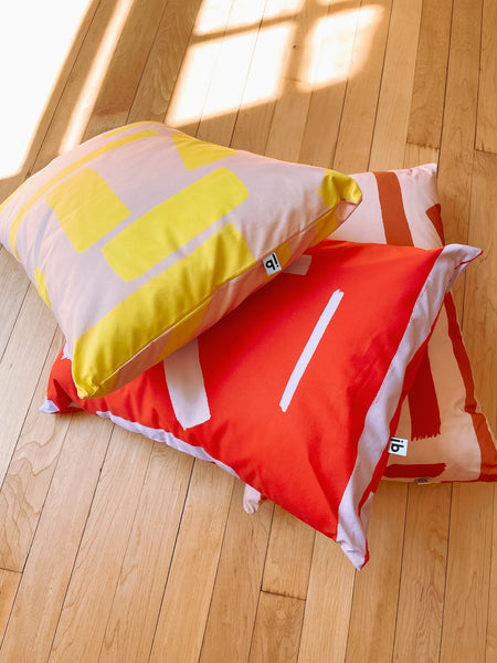 Pillows Stacked On Ground